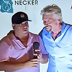 Paint of a woman diving into a swimming pool and a red F1 car in the background